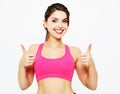 Portrait of a young fitness woman showing ok sign isolated on a Royalty Free Stock Photo