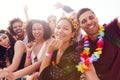Portrait Of Young Friends In Audience Behind Barrier At Outdoor Music Festival Royalty Free Stock Photo