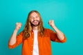 Portrait of young funky hippie extraordinary man blond long hair raised fists up celebrating his triumph isolated on Royalty Free Stock Photo
