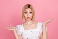 Portrait of young funny girl blonde short hair shrug shoulders dilemma staring you dont know her password isolated on Royalty Free Stock Photo