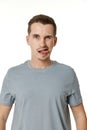 young funny man grimacing on white background Royalty Free Stock Photo