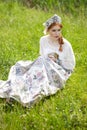 Portrait of Young Gentle caucasian Girl Posing Holding Duckling in Russian Style Dress and  Kokoshnik Outdoors Royalty Free Stock Photo