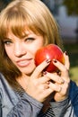 Portrait young girl with apple Royalty Free Stock Photo