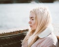 Portrait of a young girl, blonde with bleached hair, Caucasian. Scandinavian style. Close - up of a teenage woman looking past a Royalty Free Stock Photo
