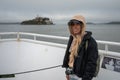 Portrait of a young girl  on the boat sailing through the sea towards the island of Alcatraz Royalty Free Stock Photo