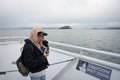 Portrait of a young girl  on the boat sailing through the sea towards the island of Alcatraz Royalty Free Stock Photo