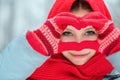 Woman hands in red winter gloves. Heart symbol shaped Lifestyle and Feelings concept. Royalty Free Stock Photo