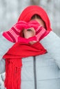 Woman hands in red winter gloves. Heart symbol shaped Lifestyle and Feelings concept. Royalty Free Stock Photo