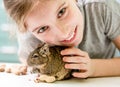 Portrait of young girl with degu squirrel Royalty Free Stock Photo
