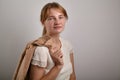 Portrait of young girl with ginger hair dressed in casual white blouse Royalty Free Stock Photo