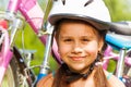 Portrait of a young girl in helmet with bike Royalty Free Stock Photo