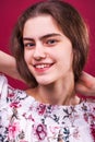 Portrait of young girl on isolated plum background