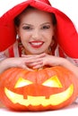 Portrait of young girl laying on halloween pumpkin Royalty Free Stock Photo