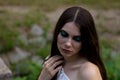 Portrait of young girl with long hair in forest. Royalty Free Stock Photo