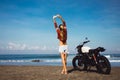 Portrait young girl on motorbike