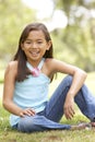 Portrait Of Young Girl In Park Royalty Free Stock Photo