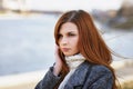 Portrait of a young girl with a pensive look on the waterfront Royalty Free Stock Photo