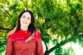 Portrait of young girl in red and blue clothes with proud attitude of herself and her youth