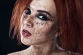 Portrait of young girl with red hair and ground coffee on the face. Photo with art makeup. Mature woman making cosmetic mask. Face Royalty Free Stock Photo