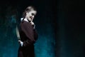 Portrait of a young girl in school uniform as killer woman