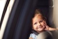 Portrait Of Young Girl Sitting In Child Safety Seat On Car Journey Looking Out Of Window Royalty Free Stock Photo