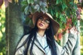 Portrait of a young girl in a wide-brimmed hat in an autumn Park . Royalty Free Stock Photo