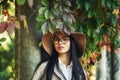 Portrait of a young girl in a wide-brimmed hat in an autumn Park . Royalty Free Stock Photo