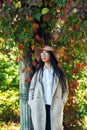 Portrait of a young girl in a wide-brimmed hat in an autumn Park . Royalty Free Stock Photo