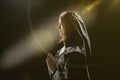 Portrait of a young girl 25-30 years old in monastic clothes, a woman praying with folded hands, a symbol of faith and hope Royalty Free Stock Photo