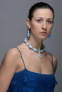 Portrait of young lady with earrings and necklace Royalty Free Stock Photo