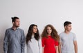 Portrait of young group of friends in a studio, stand out from the crowd concept. Royalty Free Stock Photo