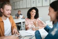 Portrait of young group of people working together in office. Group of students studying together in classroom. Boy and