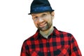 Portrait of a young guy in a hat and a red plaid shirt on a white background. A bearded man with a smile on his face Royalty Free Stock Photo