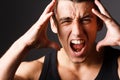 Portrait of young guy who grabs his head in hands. Head stress smokes. Square. Royalty Free Stock Photo