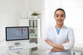 Portrait of young gynecologist in modern clinic