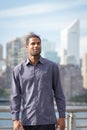 Portrait of young handsome African American man with NYC skyline Royalty Free Stock Photo