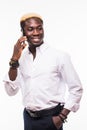 Isolated portrait of a young and handsome African American man wearing glasses and a suit talking on a phone and smiling Royalty Free Stock Photo