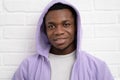 Portrait young handsome african black man wearing denim jeans jacket against brick with wall outdoors with copyspace. Royalty Free Stock Photo