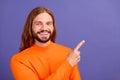 Portrait of young handsome blond long hair man wearing orange trendy sweater direct finger novelty isolated on purple Royalty Free Stock Photo