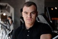 Portrait of young handsome bodybuilder man in gym while training. Royalty Free Stock Photo