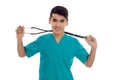 Portrait of young handsome brunette man doctor in blue uniform with stethoscope looking and smiling on camera isolated Royalty Free Stock Photo