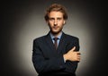 Portrait of young handsome businessman on black background Royalty Free Stock Photo