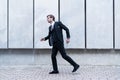 Businessman wearing suit running to work Royalty Free Stock Photo