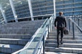 Businessman wearing suit running up the stairs Royalty Free Stock Photo