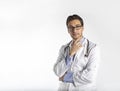 Portrait of young handsome doctor in medical gown and stethoscope isolated on white background Royalty Free Stock Photo