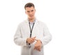 Portrait of young handsome doctor showing watch like being late