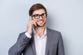 Portrait of young handsome glad happy man in suit calling to his business colleague Royalty Free Stock Photo