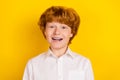 Portrait of young handsome good looking schoolboy waiting 1-september back to school isolated on yellow color background