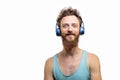 Handsome hipster man with beard smiling at camera over white background. Royalty Free Stock Photo