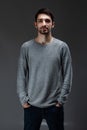 Portrait of young handsome male with beard wearing blouse